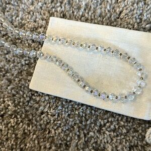 Clear beaded necklace with beautiful iridescent beads and gold chain long length